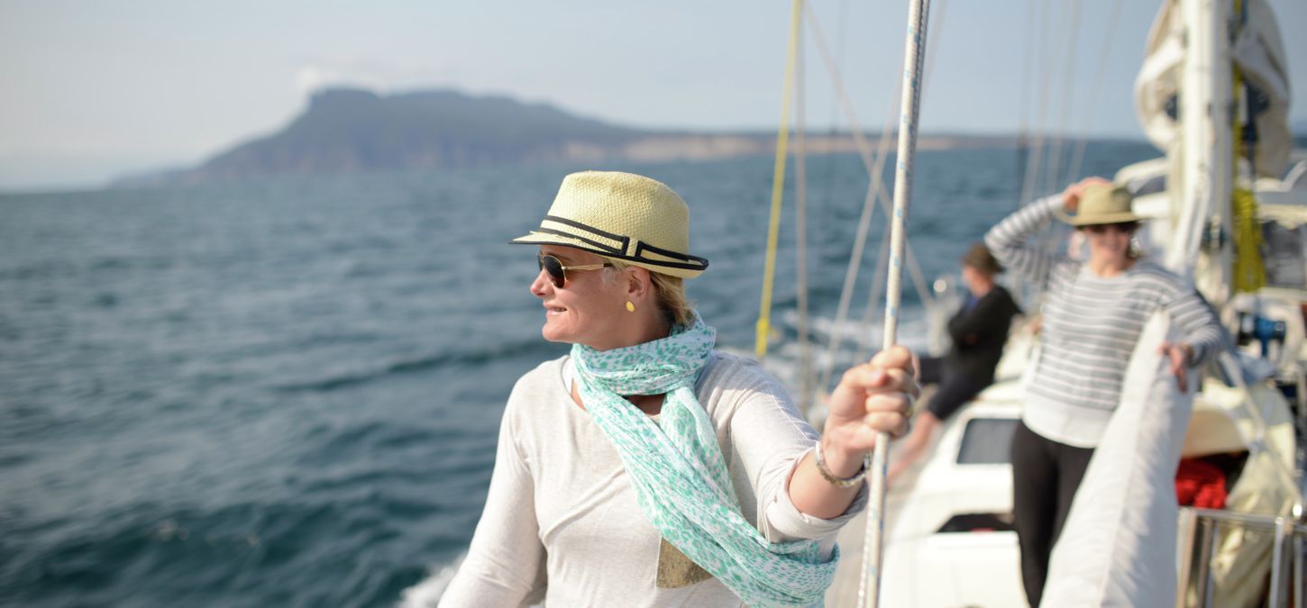 Guest overlooking the ocean on yacht in Wineglass Bay