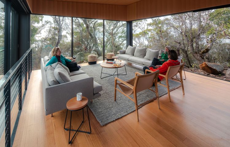 Guests in living room at Crescent Lodge