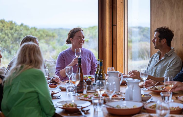 Guests enjoying food and drinks at Three Capes eco-camp