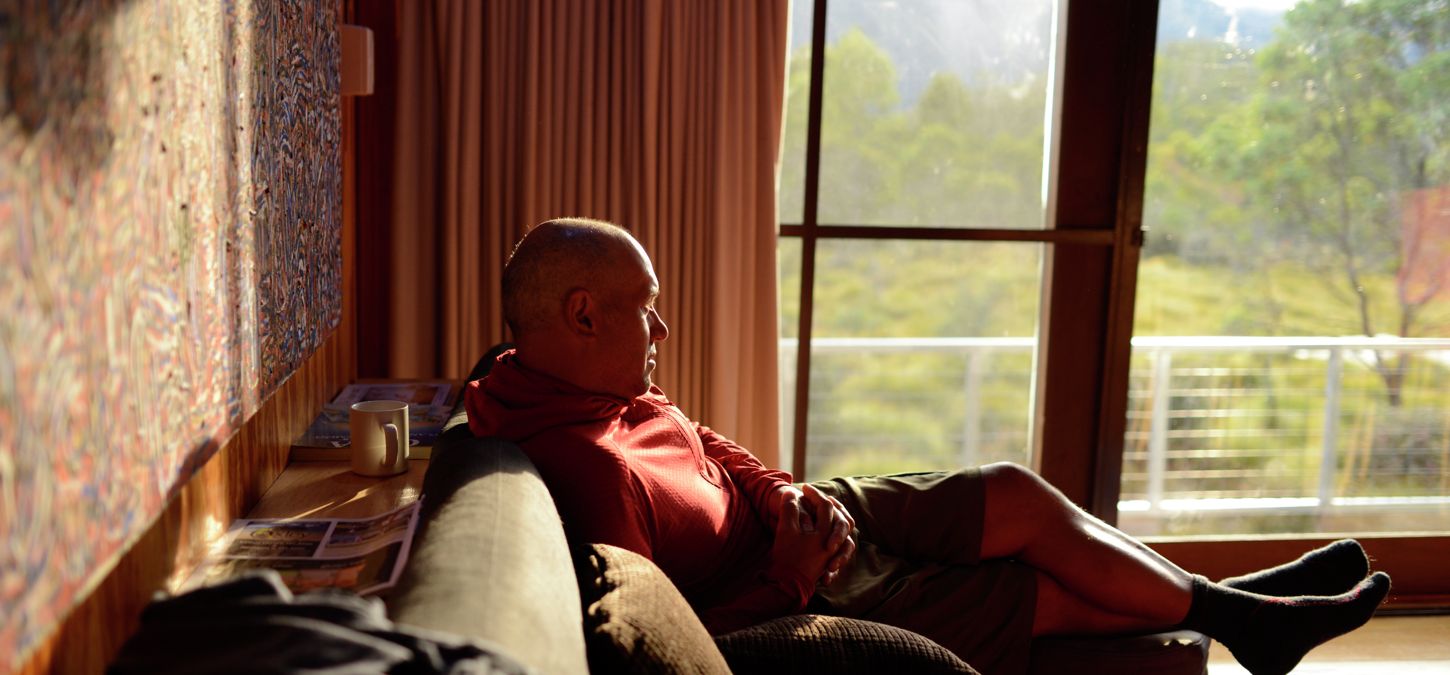 Guest relaxing in the lounge area of our private accommodation, Overland Track, Tasmania