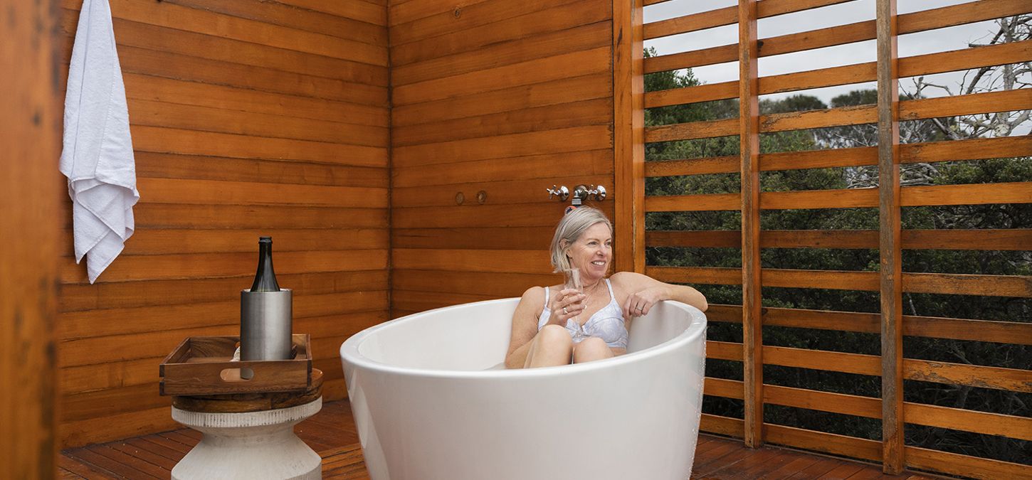 On the Bay of Fires Lodge Walk, unwind with a soak in our private outdoor bath