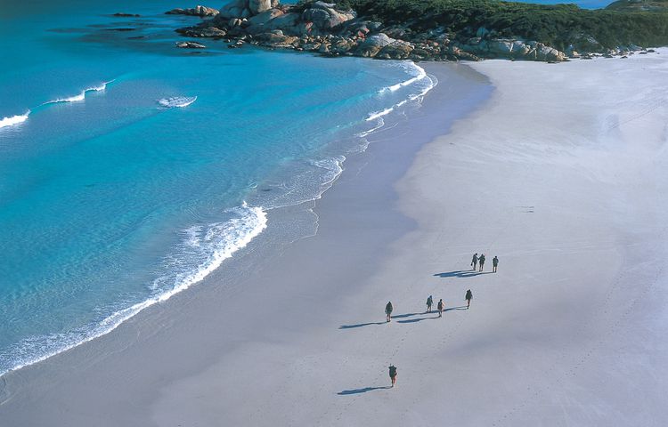 Walkers hiking along Bay of Fires beach