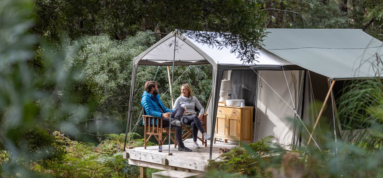 Guests sitting in tent at Bruny Island Campsite