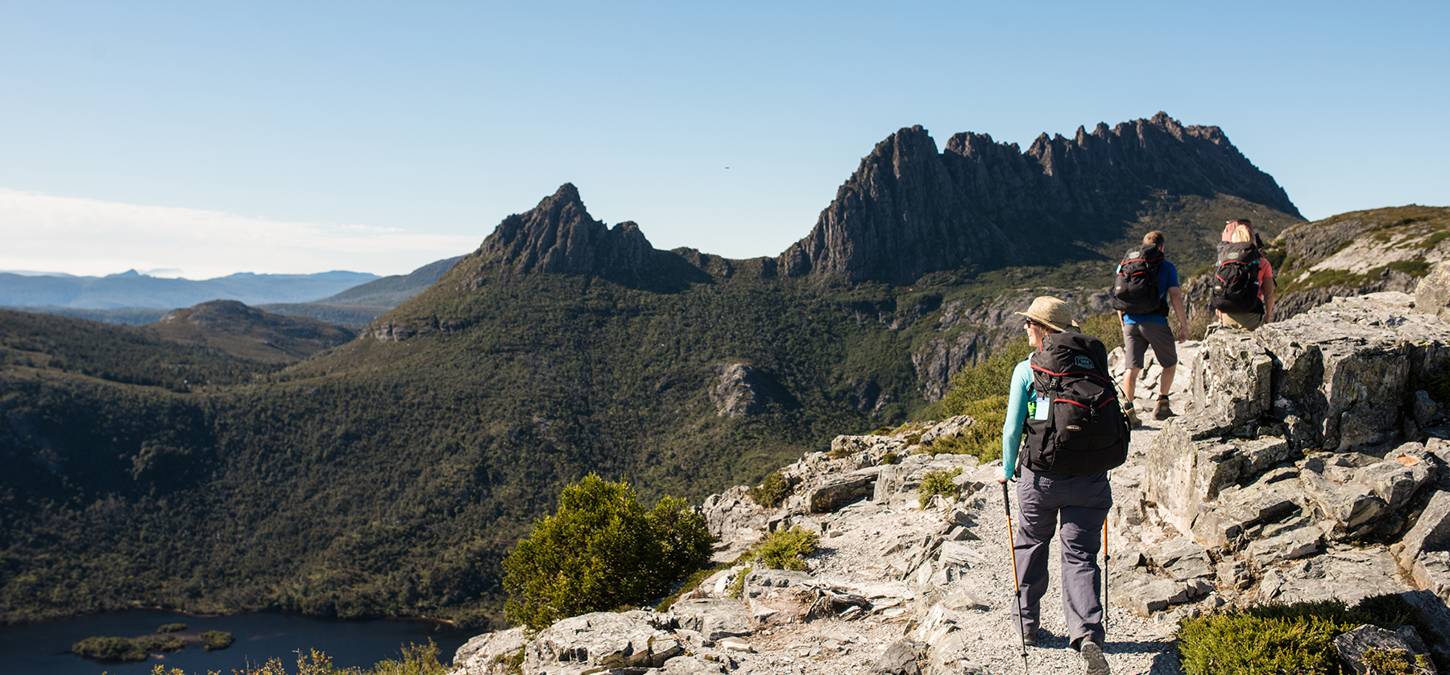 Guests walking along cliff overlooking the national park